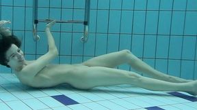 Hot and beautiful brunette teen babe showing off underwater