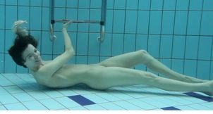 Hot and beautiful brunette teen babe showing off underwater
