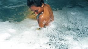 Big foam bathing with an asian model