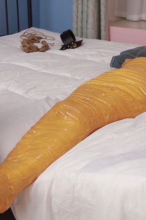 A Cute Barefoot Girlfriend Uses Tape to Bind Her Whole Body, Playing with Her Cute Bare Feet
