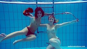 Blonde And Brunette Babes Swim