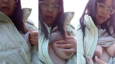 A busty Japanese woman masturbates with her nipples outdoors and gets caught by passersby.