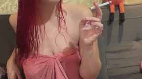 Smoking a cigarette after shower wrapped in a towel - Wet hair