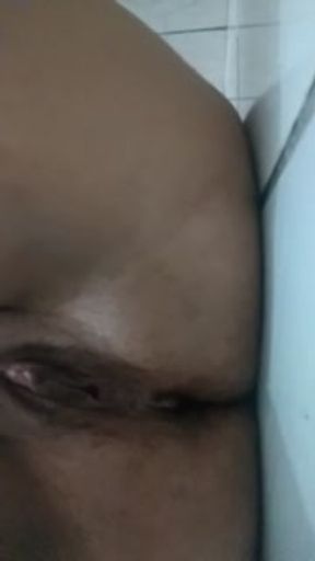 Touching herself and moaning quietly so her parents don't hear her