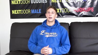 Handsome and athletic young guy jerks off at a porn audition