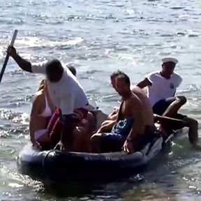 Three guys destroy a skinny blondes holes on the beach of an island