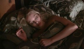 sara cuffed on the bed