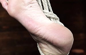 Busty slave in hogtie suspension