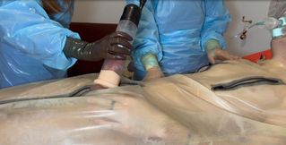 Miss Nastya and Miss Camille pump their rubber slave cock while wearing transparent surgical gloves and FULL PLASTIC PPE
