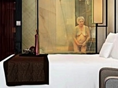 My grandmother is taking a bath at the hotel.