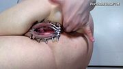 kinky FTM anal gape with pussy locked open in a cage