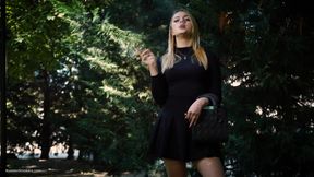 Hot Blonde Babe Smoking One Black Cigarettes in Nature