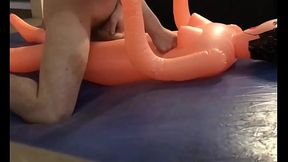 Pounding cheap female inflatable doll on blue waterbed mattress