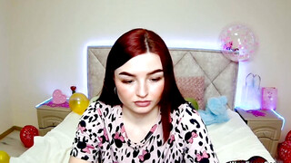 Cute redhead babe chats on webcam