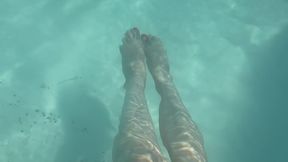 Artemisia Love showing her cute feet underwater