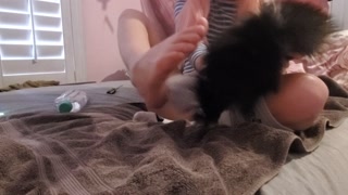 Teen tickles her own feet and enjoys rubbing oil on her small feet