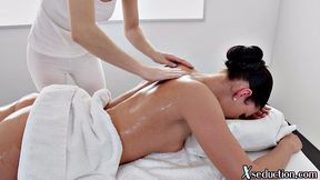 Asian masseuse scissoring her client