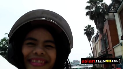 Skinny Asian teen is deep throating a big dick after meeting this backpacker on the streets.
