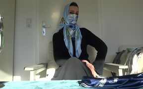 Trying on different scarfs masks with headscarves
