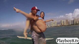 Women learning how to surf and have crab munching compete