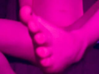 Trans girl strokes her rod and puts her feet in your face