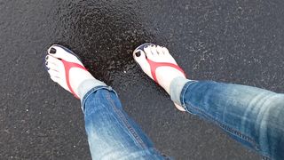 a crossdresser with magnificent soles in spin flops is provocative on the street