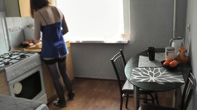 Cute girl. Sexy Assol in erotic lingerie peignoir stockings makes coffee in kitchen. Fetish. Erotica of beautiful woman. Perfect