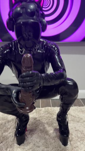 Woman in latex gloves plays with huge dildo