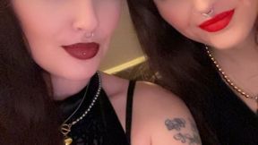 Lesbians pop balloons in a grungy basement