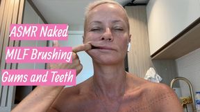 Naked MILF Brushing Gums and Teeth with Fingers in Bathroom