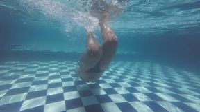 Blowing bubbles and swimming in the pool