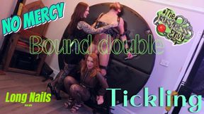 Tickled on the wheel No Mercy Double Domination Tickled by Latex wearing Dominatrix Duo Ivy Rose Scarlett and Mistress Envy