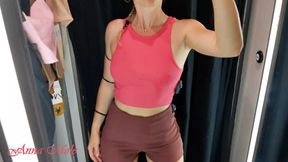 A girl with a perfect figure and small breasts tries on different clothes