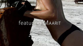Splendid brunette Maarit is masturbating outdoors