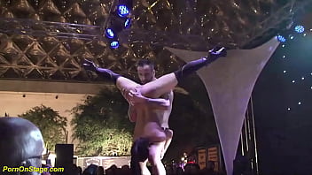 hot acrobatic couple show on public stage