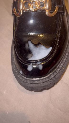 Cumming on patent loafers