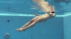 Czech beauty Lady Dee strips down in the pool skinny dipping solo