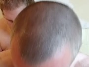 Bear licking Chaser in the Bathtub