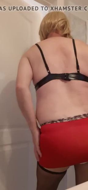 Sissy crossdresser wearing mini skirt