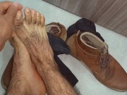 Male feet. Contemplating this lumberjack feet and hairy legs. Lick it or smell it?