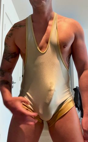 Muscle gym bro plays with his big cock in wrestling singlet