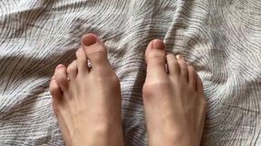 Toes with beige pedicure