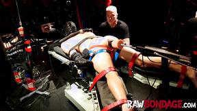 ”Chained jock Devin Franco lying face down being fisted in his booty”