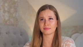 A beauty in a white robe masturbates with a vibrator