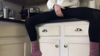 Sissy in socks and leggings playing on the counter