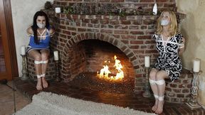 No Escape Anytime Soon For Holly Manning And Eden Wells, Who Are Tightly Trussed Up Tape Gagged And Seated Facing Each Other!