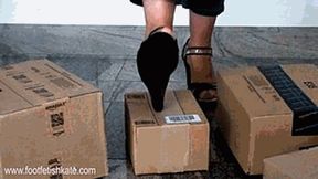 A lot of big boxes crushed with my black wedges sandals