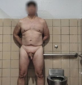Exhibitionist old masturbator in men&#039;s room stall waiting to be watched by a friend