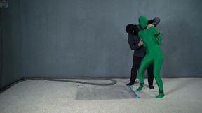 Bondage green zentai leather handcuffs in a vacuum bag