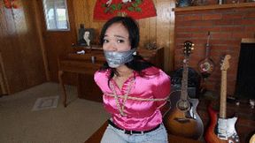 Raven Lynette cruelly wraparound tape gagged with mouth stuffed with her two socks and tightly tied up and hogtied, toes tied, by a stalker